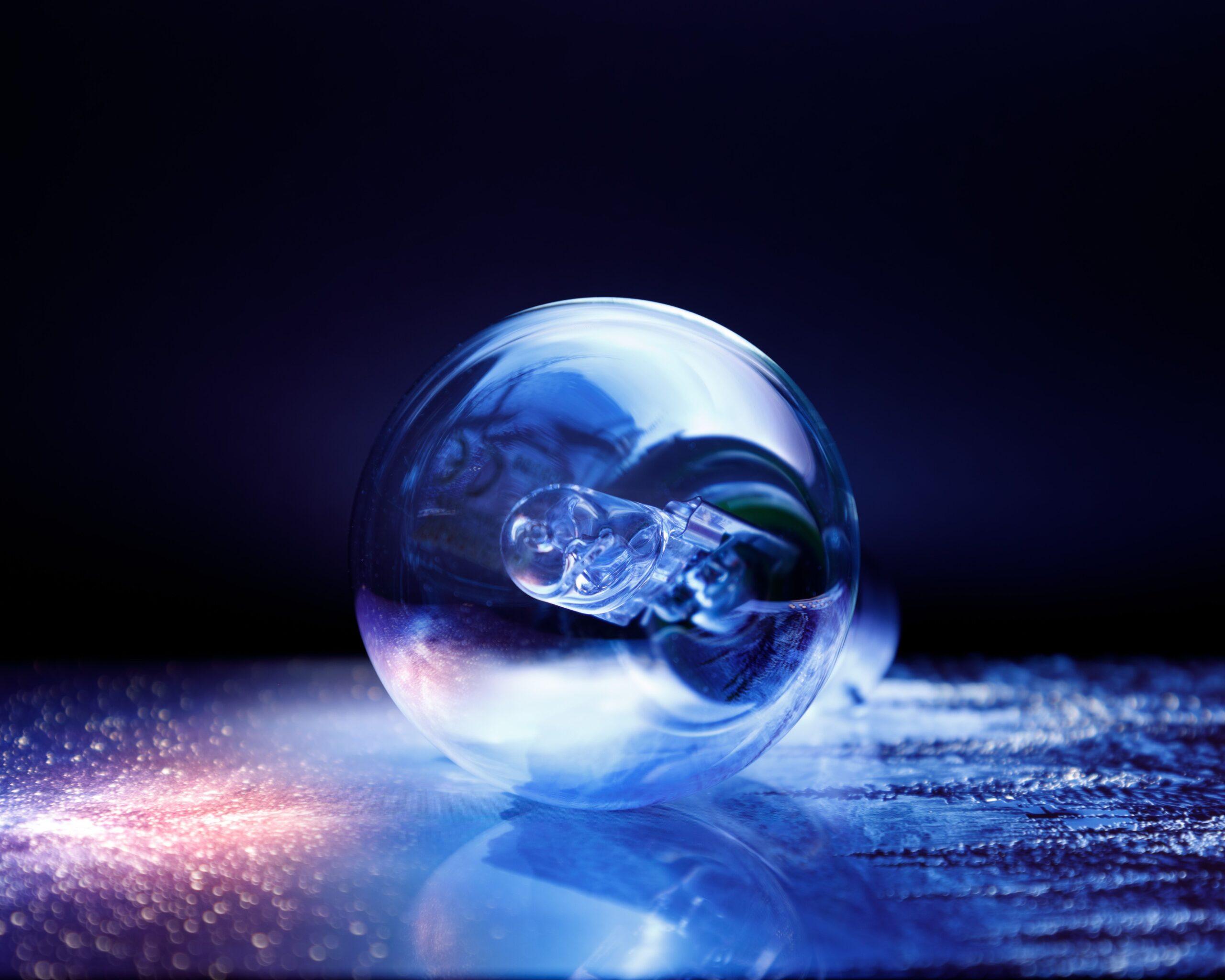 Intriguing light illuminating the light bulb in a dimly lit setting creating a mysterious aesthetic